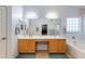 Stylish bathroom featuring double sinks, ample counter space, and tile flooring at 8637 E Olla Ave, Mesa, AZ 85212