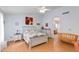 Spacious bedroom featuring light walls, wooden floors and access to bathroom at 8637 E Olla Ave, Mesa, AZ 85212