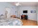 Bright bedroom with comfortable furniture and a convenient workspace at 8637 E Olla Ave, Mesa, AZ 85212