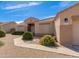 Inviting single-story home with desert landscaping and a welcoming front entrance at 8637 E Olla Ave, Mesa, AZ 85212