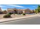 Charming single-story home with a well-manicured desert front yard, enhancing curb appeal at 8637 E Olla Ave, Mesa, AZ 85212