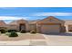 Charming single-story home with a well-manicured front yard and a two-car garage at 8637 E Olla Ave, Mesa, AZ 85212