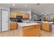 Spacious kitchen featuring an island, stainless steel appliances, and plenty of counter space at 8637 E Olla Ave, Mesa, AZ 85212
