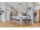 Eat-in kitchen featuring a bar with seating and views of the main kitchen with stainless appliances at 8637 E Olla Ave, Mesa, AZ 85212