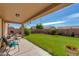 Spacious covered patio providing shade and a view of the expansive backyard at 8637 E Olla Ave, Mesa, AZ 85212
