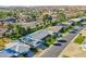An aerial perspective of homes with well-kept lawns and tree-lined streets in a friendly neighborhood at 10825 W Caron Dr, Sun City, AZ 85351