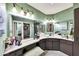 The bathroom features a vanity, sink, mirror, and ample storage at 10825 W Caron Dr, Sun City, AZ 85351