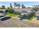 Beautiful single-story home showcasing mature trees and a spacious two-car garage at 10825 W Caron Dr, Sun City, AZ 85351