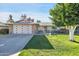 Inviting single-story home with well-kept lawn, charming curb appeal, and a two-car garage at 10825 W Caron Dr, Sun City, AZ 85351