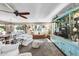 Bright open concept living room with comfortable seating, dining area, and stylish decor at 10825 W Caron Dr, Sun City, AZ 85351