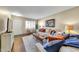 Inviting living room featuring hardwood floors, stylish furniture, and ample natural light at 10825 W Caron Dr, Sun City, AZ 85351