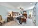 A bright and airy main bedroom with a king size bed and outdoor access at 10825 W Caron Dr, Sun City, AZ 85351