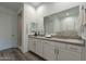 Elegant bathroom with double vanity, large mirror, and walk-in shower at 11673 N 136Th St # 1013, Scottsdale, AZ 85259