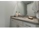 Bathroom featuring a white vanity, grey countertop, and decorative accents at 11673 N 136Th St # 1013, Scottsdale, AZ 85259