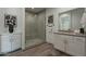 Bathroom featuring a walk-in shower, vanity, and contemporary fixtures at 11673 N 136Th St # 1013, Scottsdale, AZ 85259