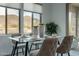 Cozy dining area with mountain views from the large windows and contemporary table setting at 11673 N 136Th St # 1013, Scottsdale, AZ 85259