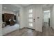Inviting foyer featuring a modern front door, leading to a bright office space at 11673 N 136Th St # 1013, Scottsdale, AZ 85259