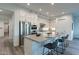 Modern kitchen with stainless steel appliances, large center island, and barstool seating at 11673 N 136Th St # 1013, Scottsdale, AZ 85259