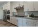 Modern kitchen with stainless steel appliances and white cabinetry at 11673 N 136Th St # 1013, Scottsdale, AZ 85259
