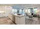Open-concept kitchen with island seating and views into the inviting living area at 11673 N 136Th St # 1013, Scottsdale, AZ 85259