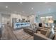 Open concept living room with kitchen, seating, and dining areas for modern living at 11673 N 136Th St # 1013, Scottsdale, AZ 85259