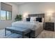 Serene bedroom with soft lighting, plush bedding, and comfortable seating at 11673 N 136Th St # 1013, Scottsdale, AZ 85259