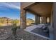 Covered patio with desert views featuring neutral colors and lounge chairs at 11673 N 136Th St # 1013, Scottsdale, AZ 85259