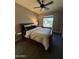 This bedroom features hardwood floors, neutral walls, and a ceiling fan at 13211 W Hummingbird Ter, Peoria, AZ 85383