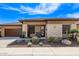 Single-story home featuring desert landscaping, neutral colors, and stone accents at 13211 W Hummingbird Ter, Peoria, AZ 85383