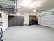 Well-organized garage with storage racks, cabinets, and epoxy flooring at 13211 W Hummingbird Ter, Peoria, AZ 85383