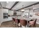 Bright kitchen with island seating, stainless steel appliances, and abundant counter space at 13211 W Hummingbird Ter, Peoria, AZ 85383