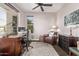 Cozy office space with a leather chair, desk, and lots of natural light at 13211 W Hummingbird Ter, Peoria, AZ 85383