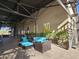 Outdoor patio area with comfortable seating and potted plants at 13211 W Hummingbird Ter, Peoria, AZ 85383