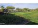 Outdoor recreational area with bocce ball, ample seating, and lush landscaping for leisure activities at 13211 W Hummingbird Ter, Peoria, AZ 85383