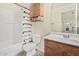 Cozy bathroom with shower-tub combo and charming wood accents at 1335 S Owl Dr, Gilbert, AZ 85296