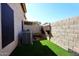 Small backyard area with artificial grass and an A/C unit at 13642 S 42Nd St, Phoenix, AZ 85044