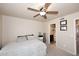 Bedroom features a ceiling fan, comfortable bed, and en-suite bathroom at 13642 S 42Nd St, Phoenix, AZ 85044