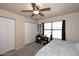 Bedroom with a ceiling fan, double closets, and window for natural light at 13642 S 42Nd St, Phoenix, AZ 85044