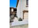 A neutral stucco townhome featuring a two-car garage, and decorative desert landscaping at 13642 S 42Nd St, Phoenix, AZ 85044