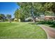 Expansive green space with walking paths, lush grass, and shaded seating areas, ideal for relaxing and enjoying nature at 13642 S 42Nd St, Phoenix, AZ 85044