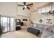 Open floor plan featuring a living room with a vaulted ceiling flowing seamlessly into the dining and kitchen areas at 13642 S 42Nd St, Phoenix, AZ 85044