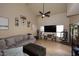 Spacious living room with vaulted ceilings, ceiling fan, tile flooring, and neutral paint at 13642 S 42Nd St, Phoenix, AZ 85044