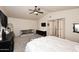 Cozy main bedroom featuring a comfortable bed, TV, and carpet floors at 13642 S 42Nd St, Phoenix, AZ 85044