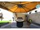 Covered patio area features a round fire pit with seating and string lights at 13642 S 42Nd St, Phoenix, AZ 85044