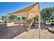 Community playground offering a safe and fun environment for children to play and explore under a large shade canopy at 13642 S 42Nd St, Phoenix, AZ 85044
