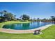 Peaceful community pond featuring a soothing fountain, lush greenery, and serene walking path at 13642 S 42Nd St, Phoenix, AZ 85044