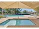 Hot tub and pool for residents with lounge chairs and sunbathing area at 13642 S 42Nd St, Phoenix, AZ 85044