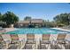 Beautiful pool with lounge chairs and a view of a charming community building at 13642 S 42Nd St, Phoenix, AZ 85044