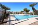 Enjoy the community swimming pool framed by palm trees, lounge seating, and shaded pergola areas at 13642 S 42Nd St, Phoenix, AZ 85044