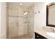 Tiled shower with glass door and granite counter at 13642 S 42Nd St, Phoenix, AZ 85044